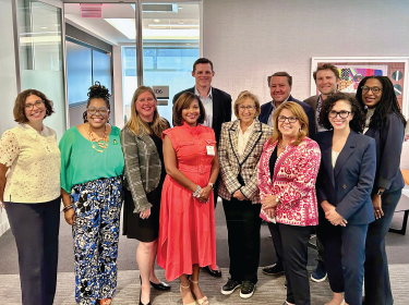 superintendent/ceo dr. angela chapman smiles with leaders from across the city of columbus